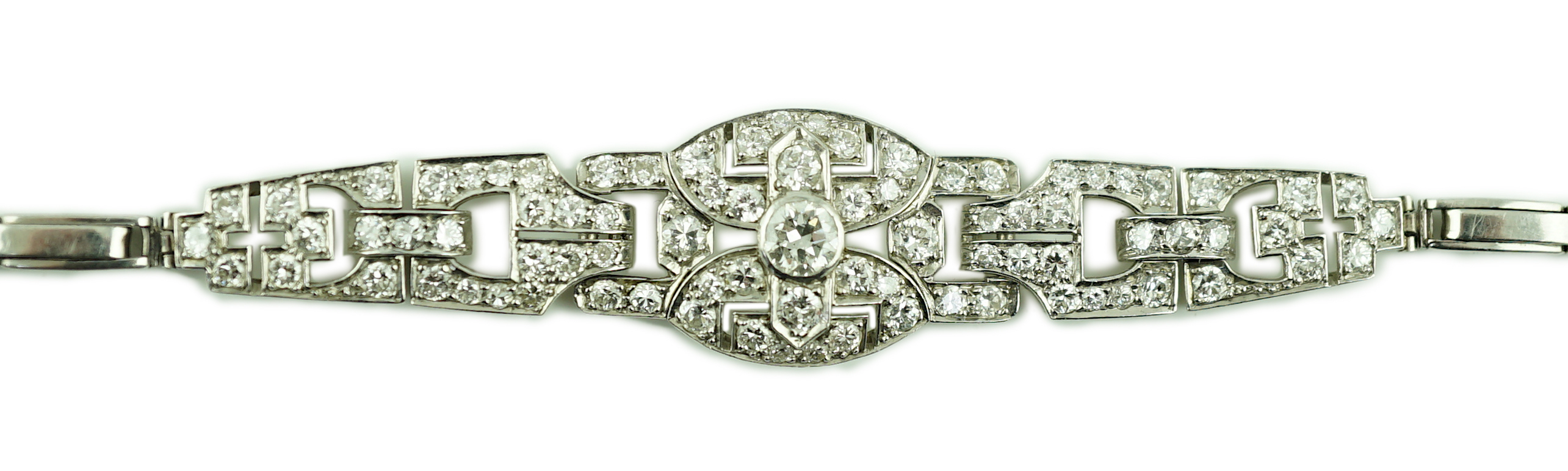 A 1950's platinum and diamond cluster set expanding link bracelet